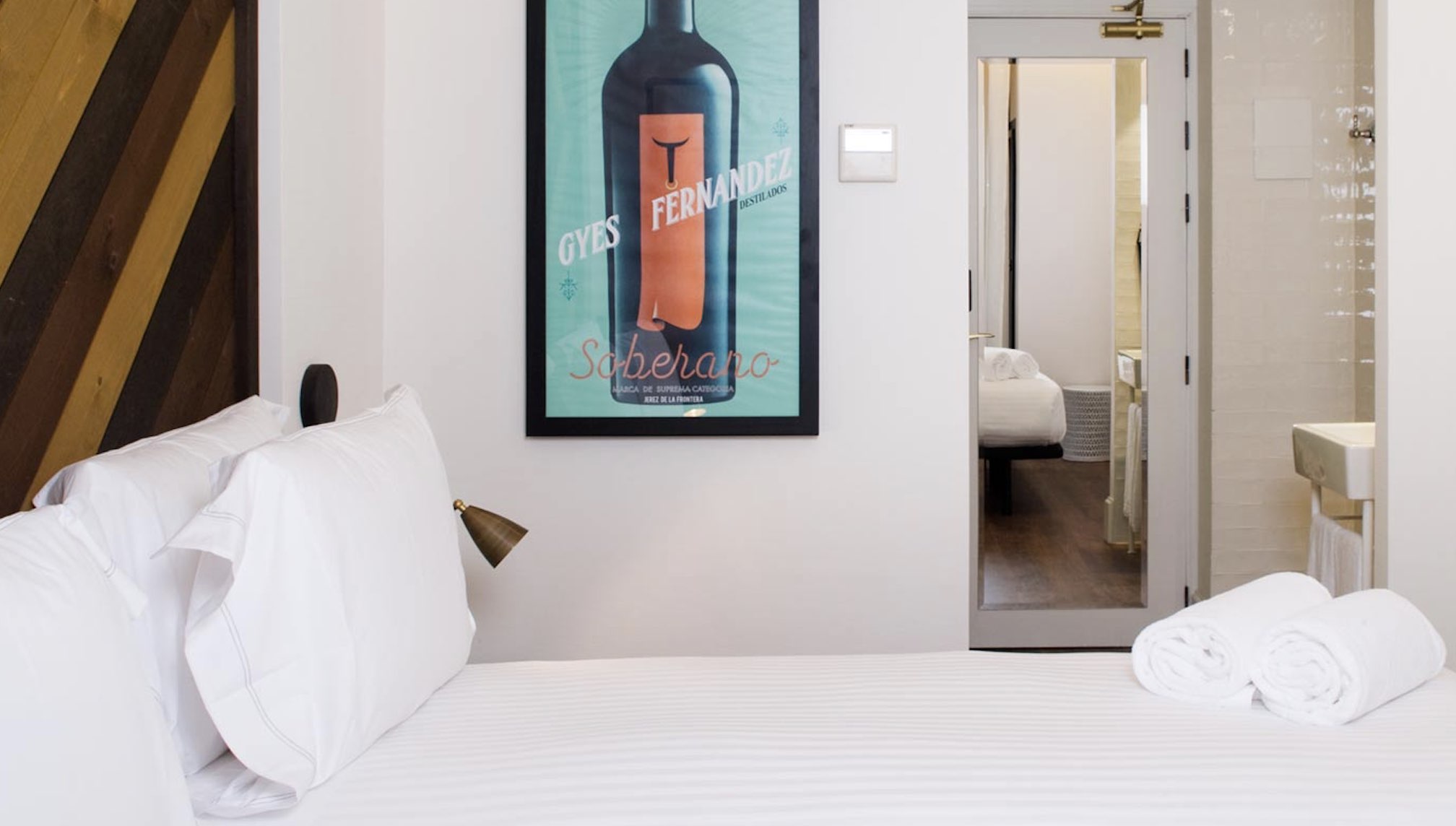 Hotel Praktik Vinoteca unique barcelona hotels room with wine poster
