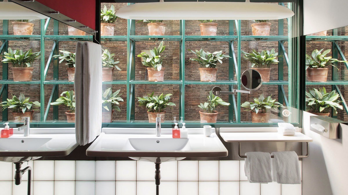 Casa Camper BCN bathroom with plants and sinks