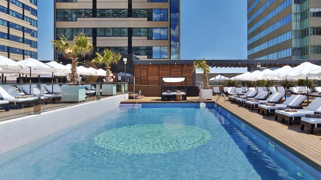 hilton diagonal mar bcn swimming pool and seating of one ofm the best design hotels in barcelona spainjpeg